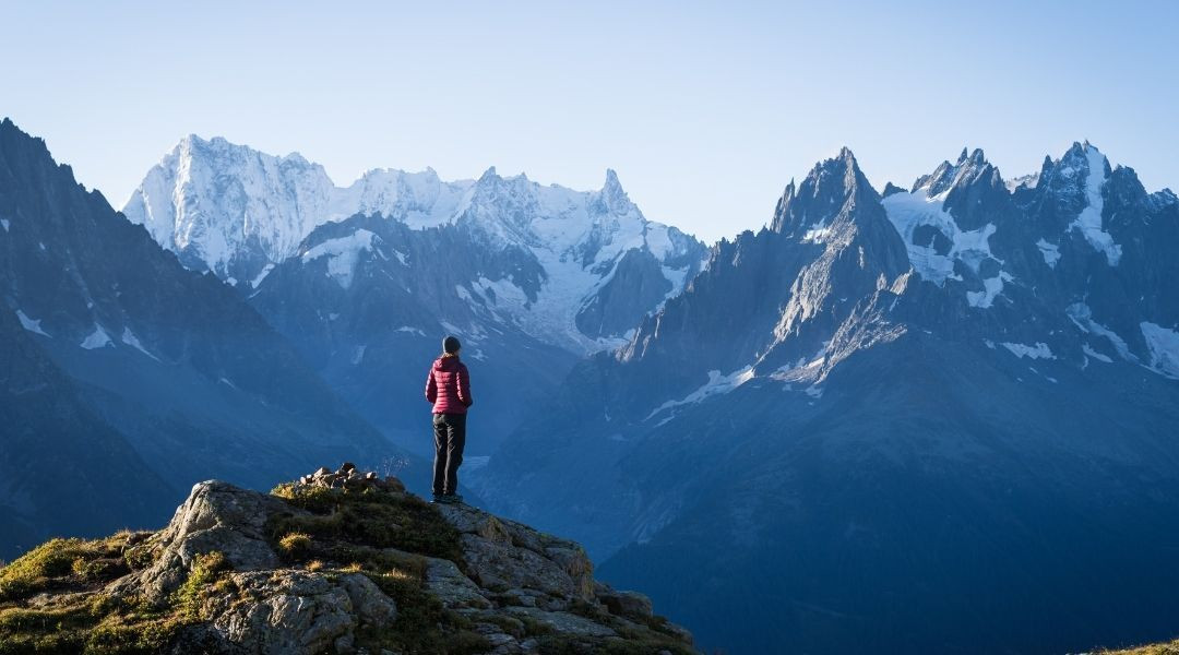 Hiker facing the Aiguilles de Chamonix - Mont-Blanc massif - Alps - France