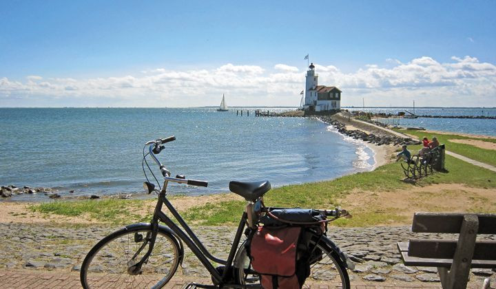 Bike in front of a lighthouse on the island of Marken