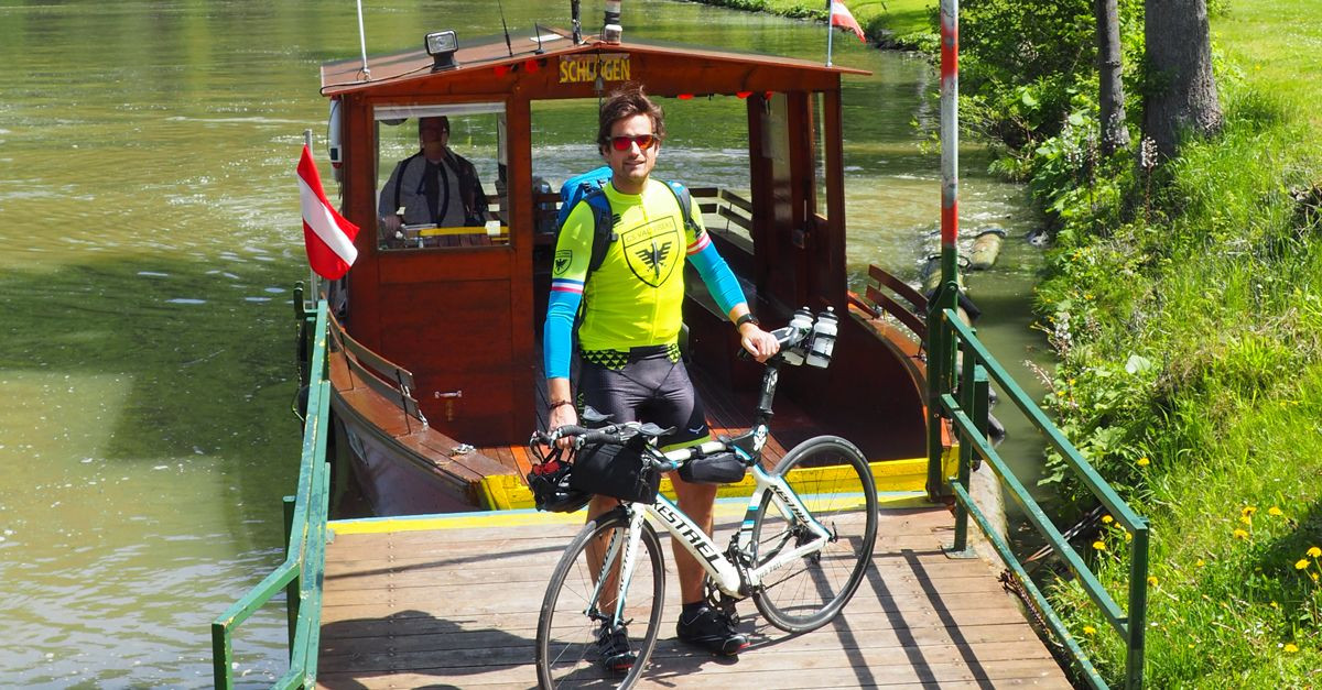 Cyclist on a ferry at Schlögen - Danube cycle path - Austria