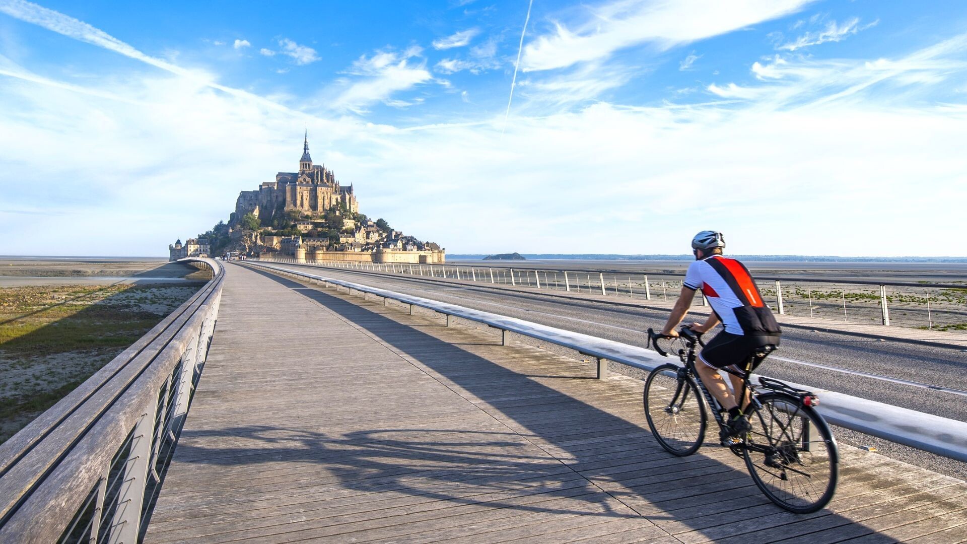 Cyclist on the causeway to Mont-Saint-Michel - Vélomaritime - France
