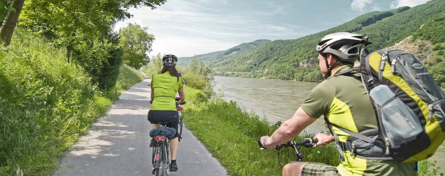 Cyclists riding along the Danube cycle path - Wachau - Austria