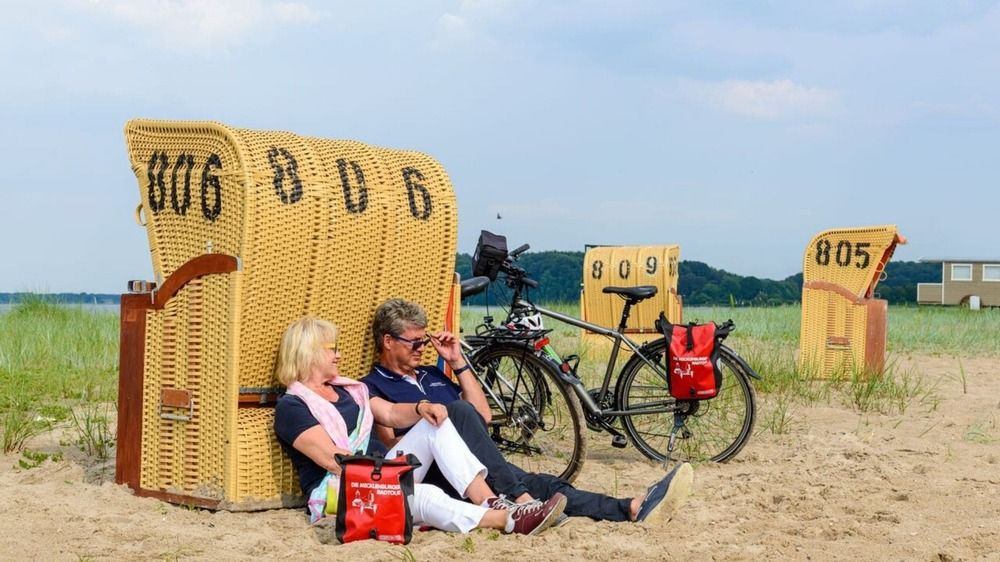 Cyclists resting on the Baltic Sea beach - Mecklenburg - Germany