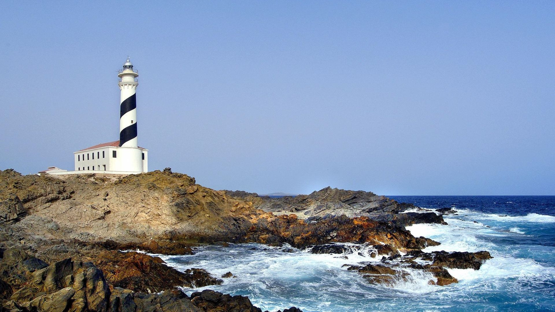 Favàritx lighthouse on the rocky coast - Menorca - Spain