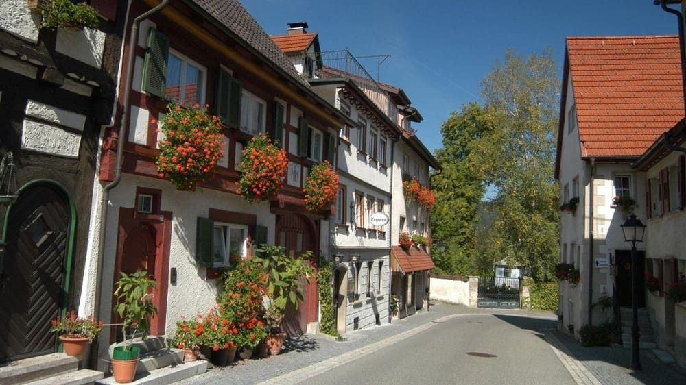 Flower-filled lane with half-timbered houses - Mühlheim - Baden-Württemberg, Germany
