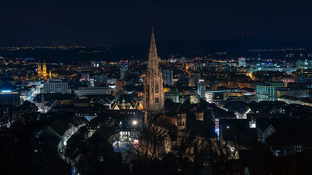 Freiburg Minster illuminated at night - Black Forest - Germany