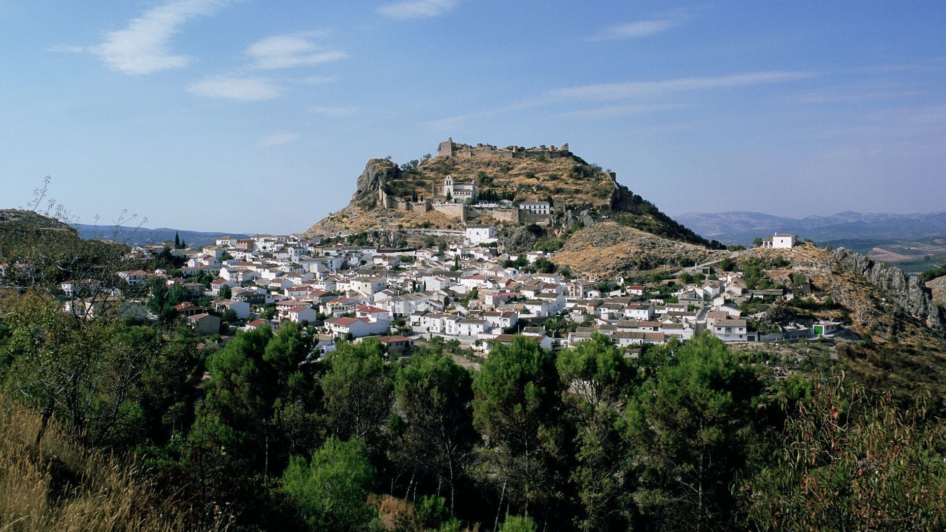 White village and hilltop castle in Andalusia - Spain
