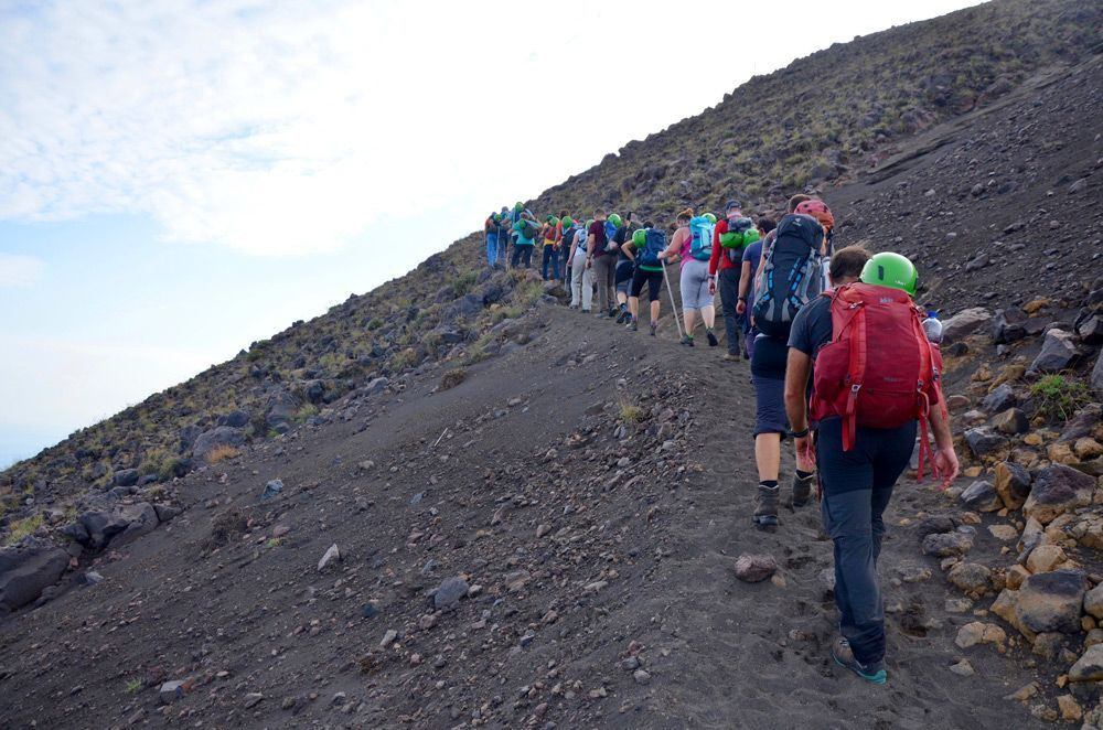 Group of hikers climbing the Stromboli volcano
