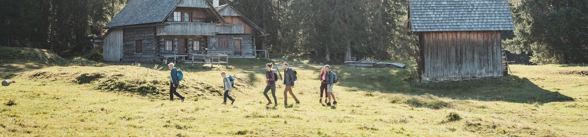 Small group of hikers accompanied by a guide in the mountains