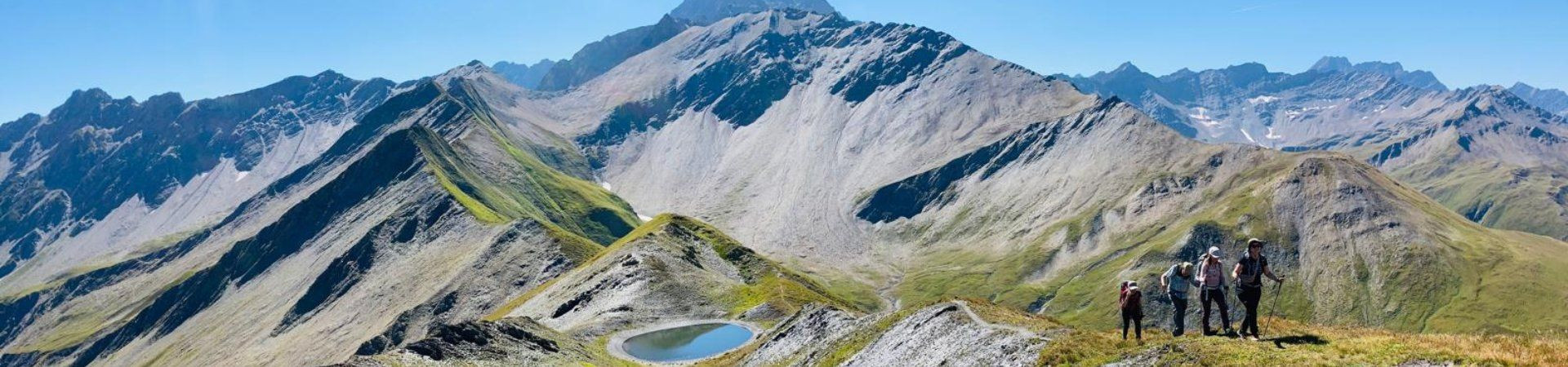 Hikers on a panoramic ridge - Alps - France