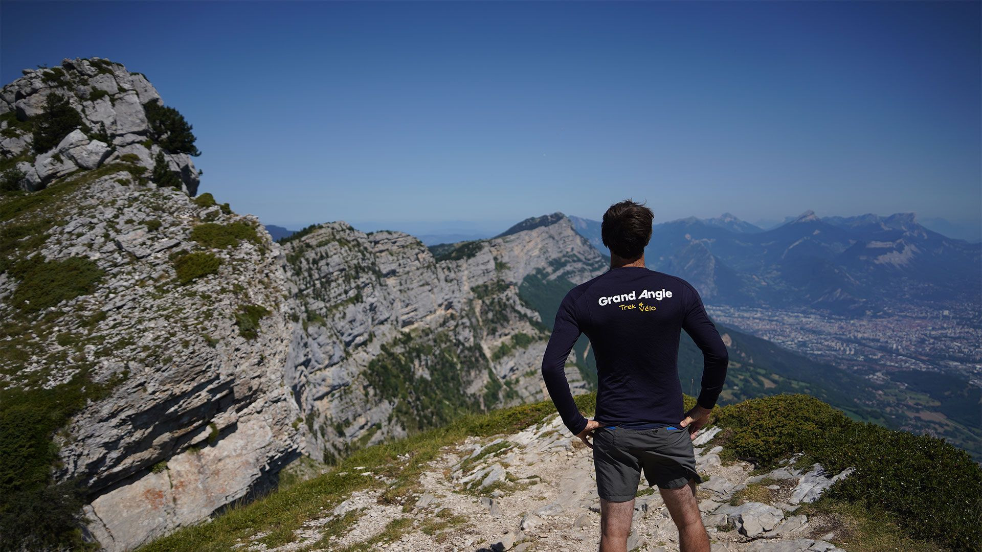 Hiker at Pic Saint-Michel overlooking Grenoble - Vercors