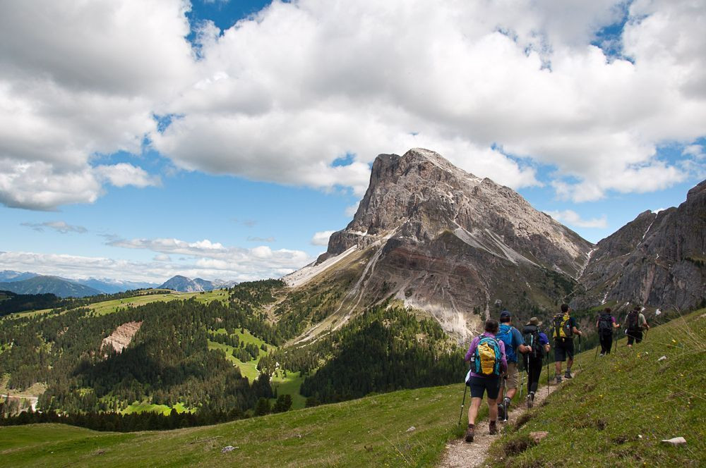 Hikers in front of the Sass de Putia (Peitlerkofel), in Puez-Odle Nature Park
