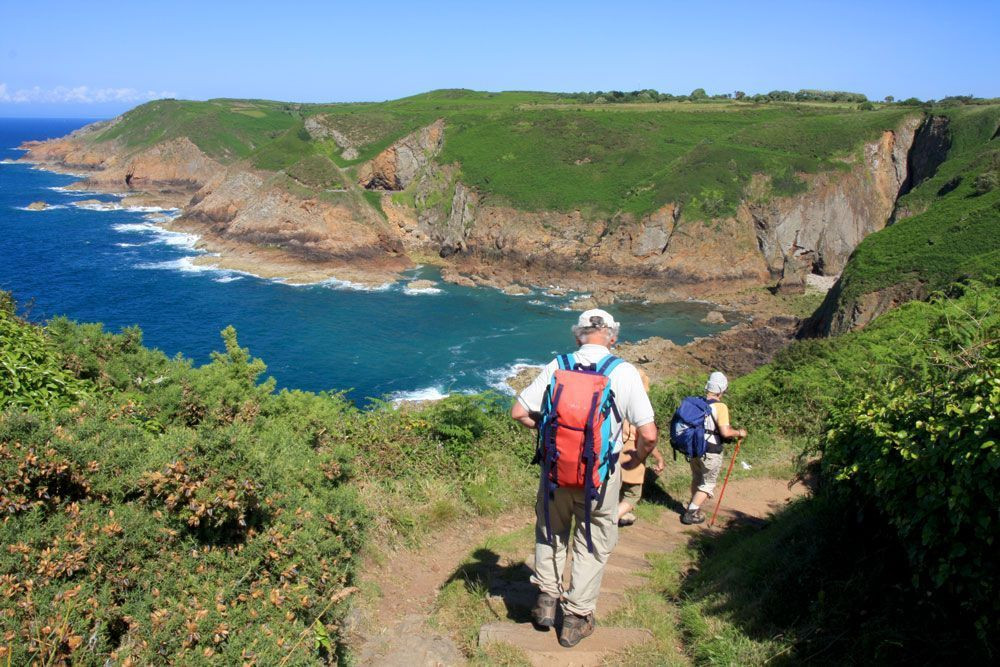 Walkers on Jersey's cliff path