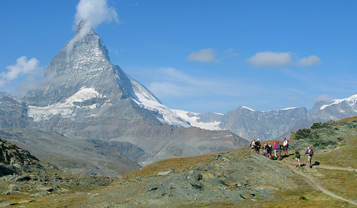 Hikers facing the Matterhorn - Zermatt - Swiss Alps