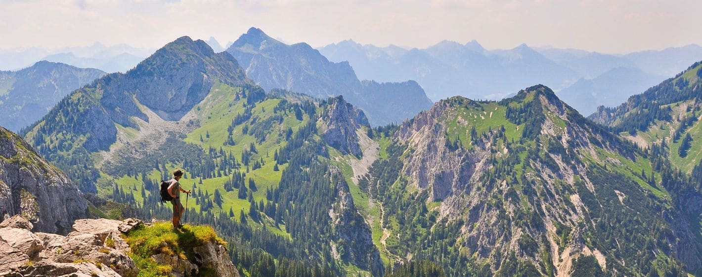 Hiker looking over the Bavarian Alps - Bavaria - Germany
