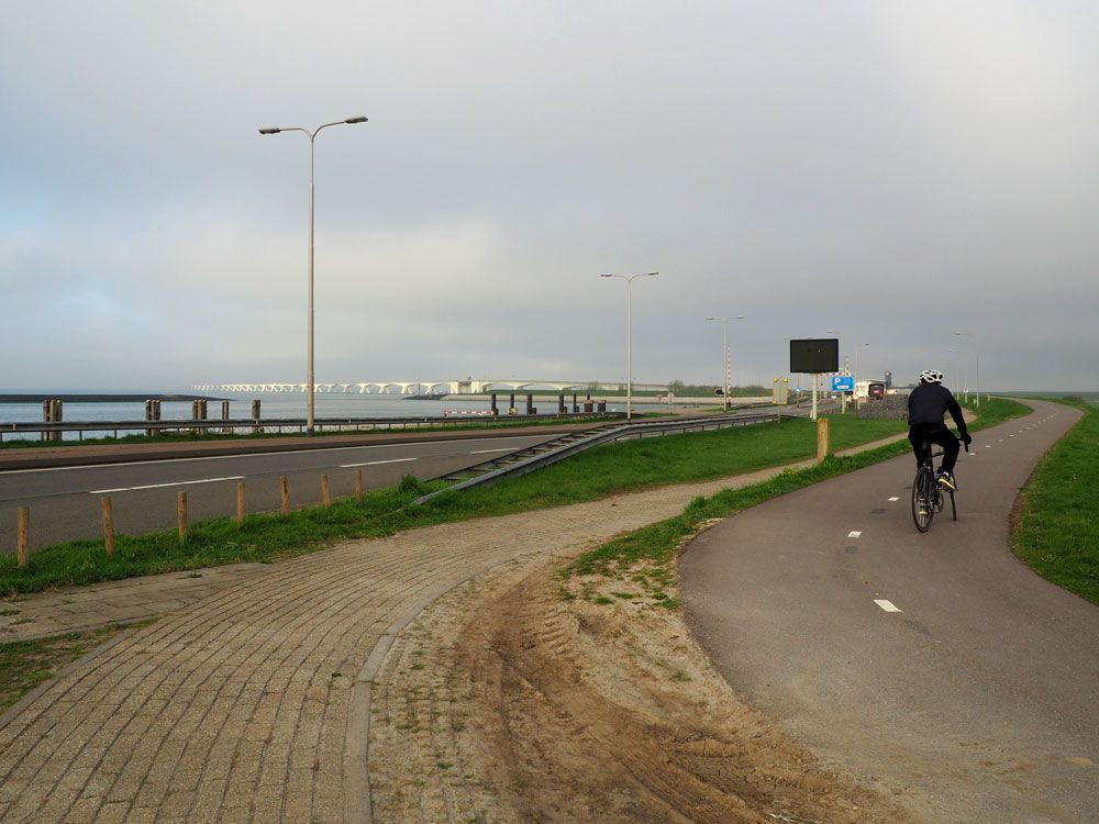 © David Praire Cycling towards the Zeeland Bridge (Zeelandbrug) in the Netherlands © David Praire