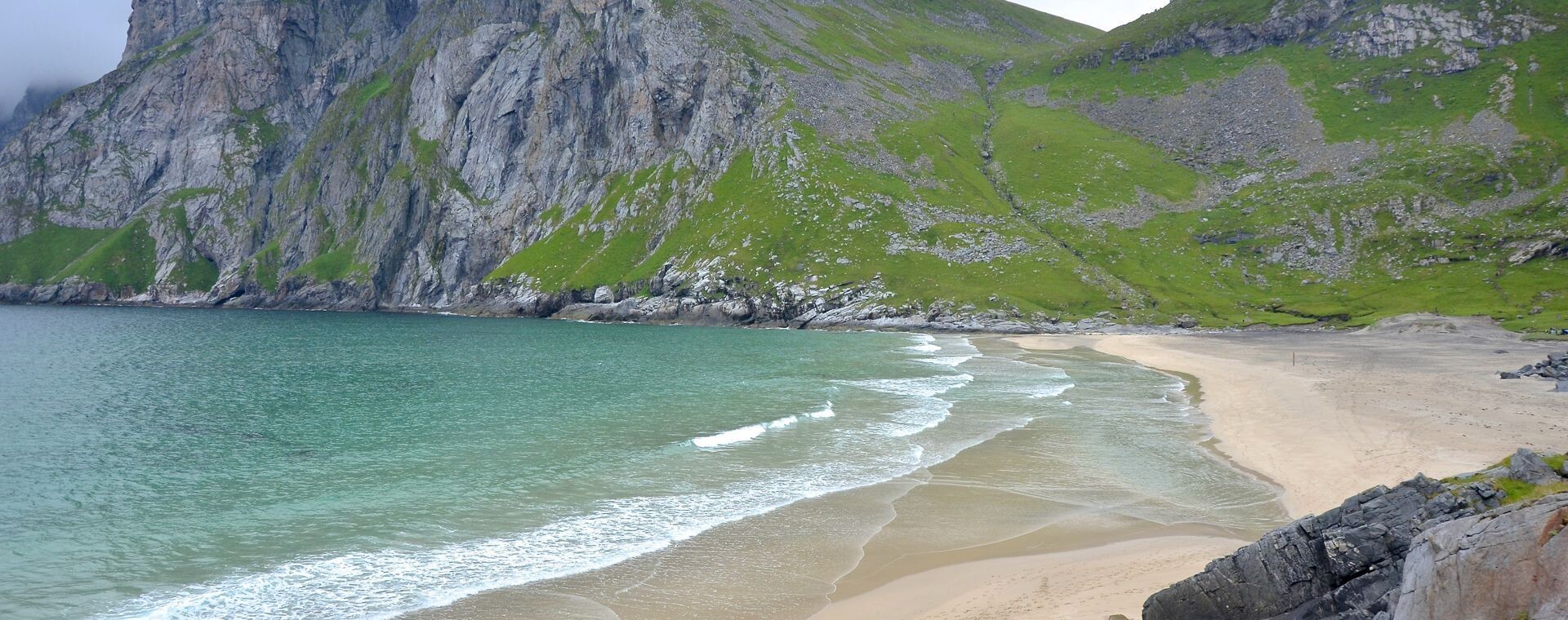 Kvalvika beach and its green cliffs - Lofoten - Norway