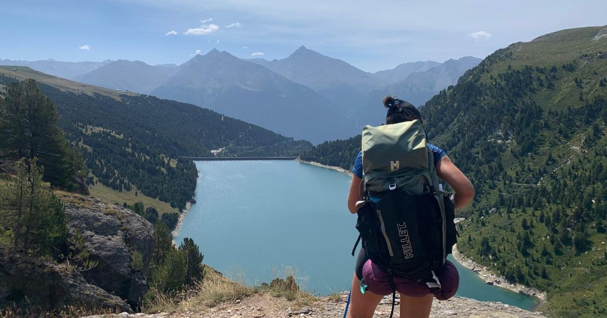 Hiker above a reservoir lake - Vanoise - Savoie