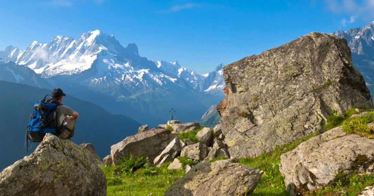 Hiker facing the Mont Blanc massif - Chamonix - Alps - France
