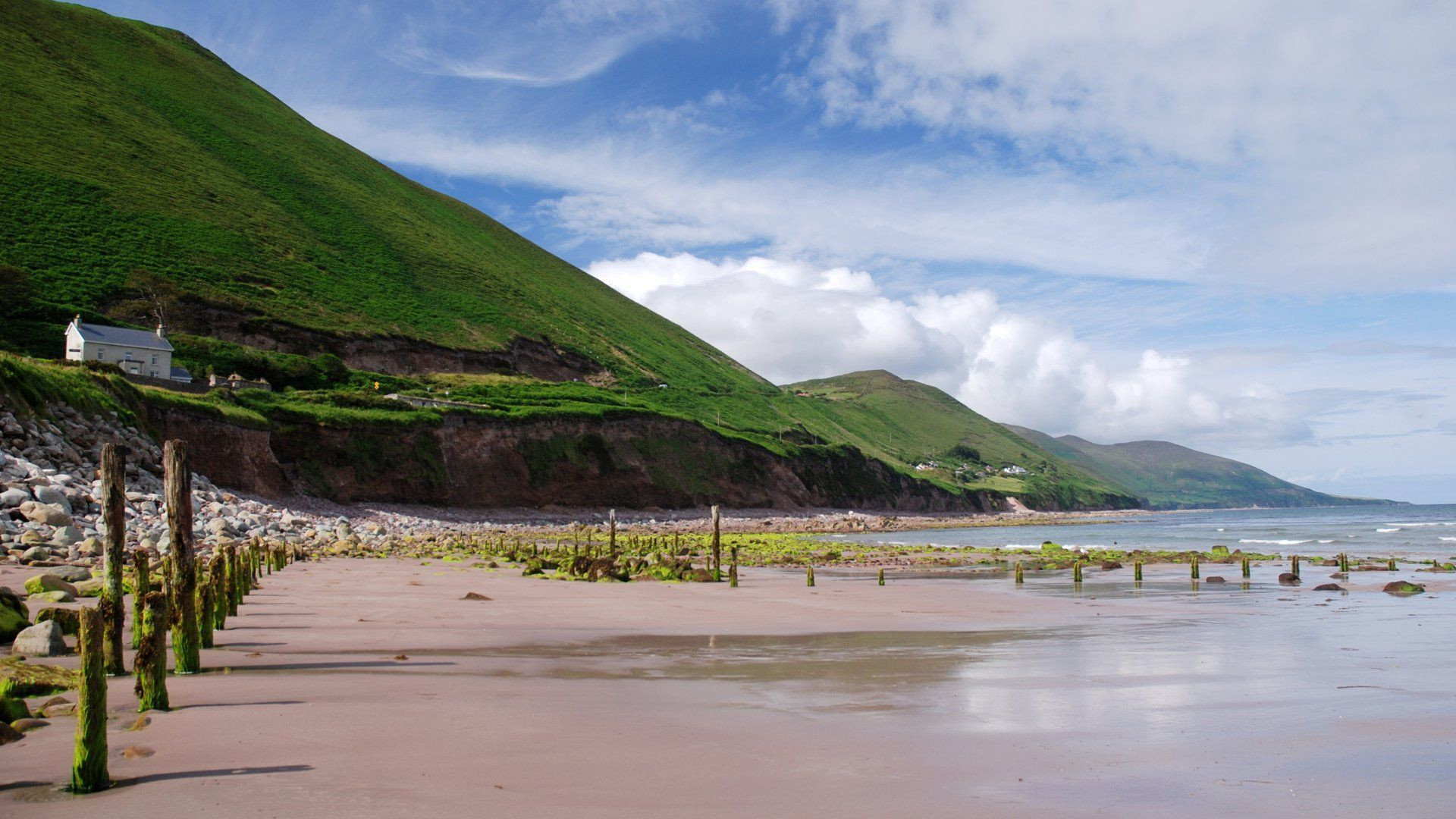 Beach and green hills on the Ring of Kerry - Ireland