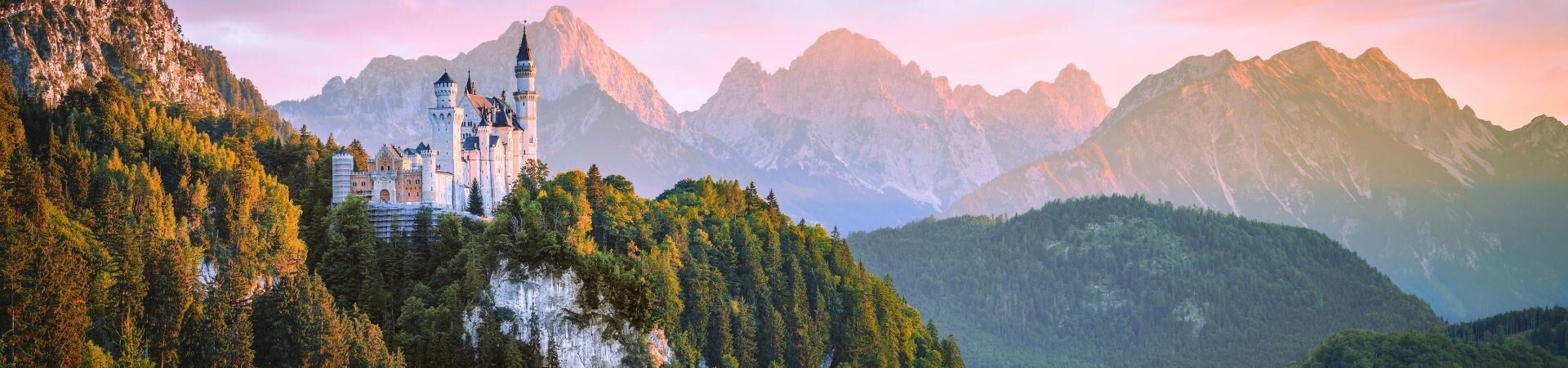 Neuschwanstein Castle at sunset before the Alps - Bavaria - Germany