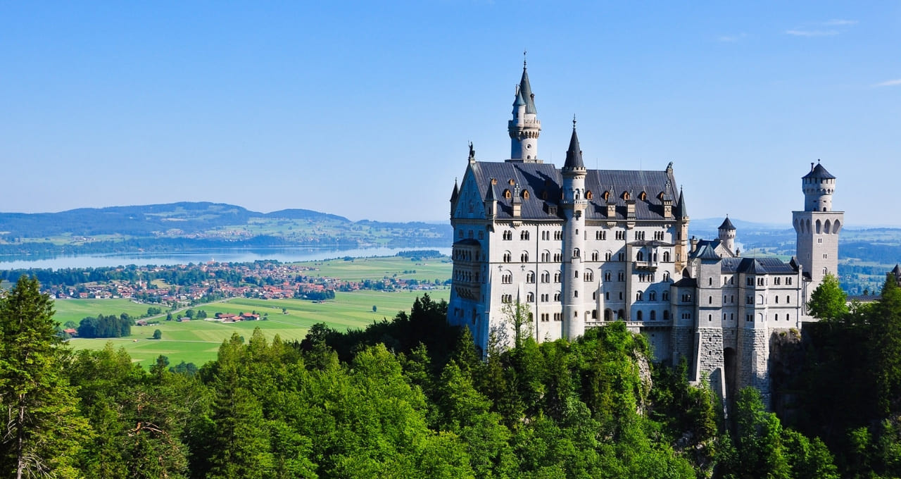 Neuschwanstein Castle surrounded by greenery - Bavaria - Germany