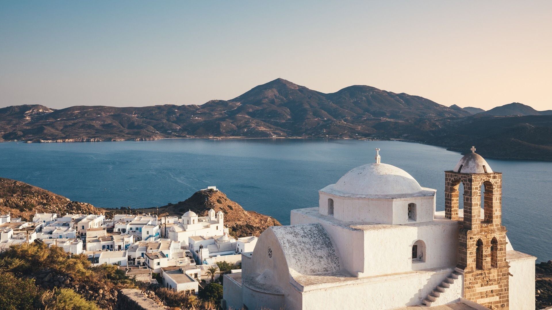 Orthodox church above the bay - Plaka, Milos - Greece