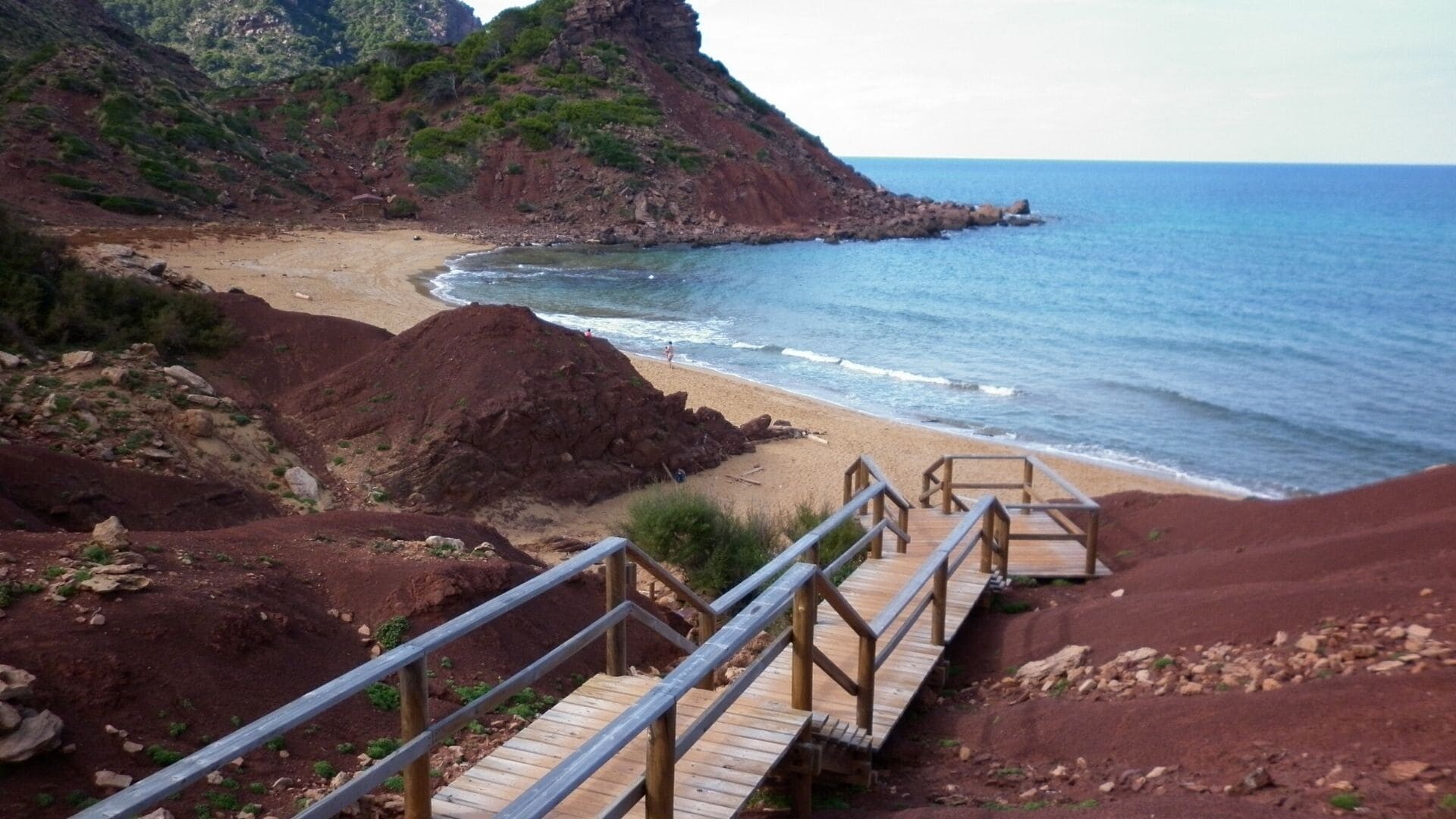 Sandy cove and wooden walkway at Cala del Pilar - Menorca - Balearic Islands, Spain