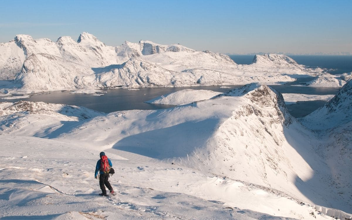 Snowshoer on a snowy ridge - Lofoten Islands - Norway