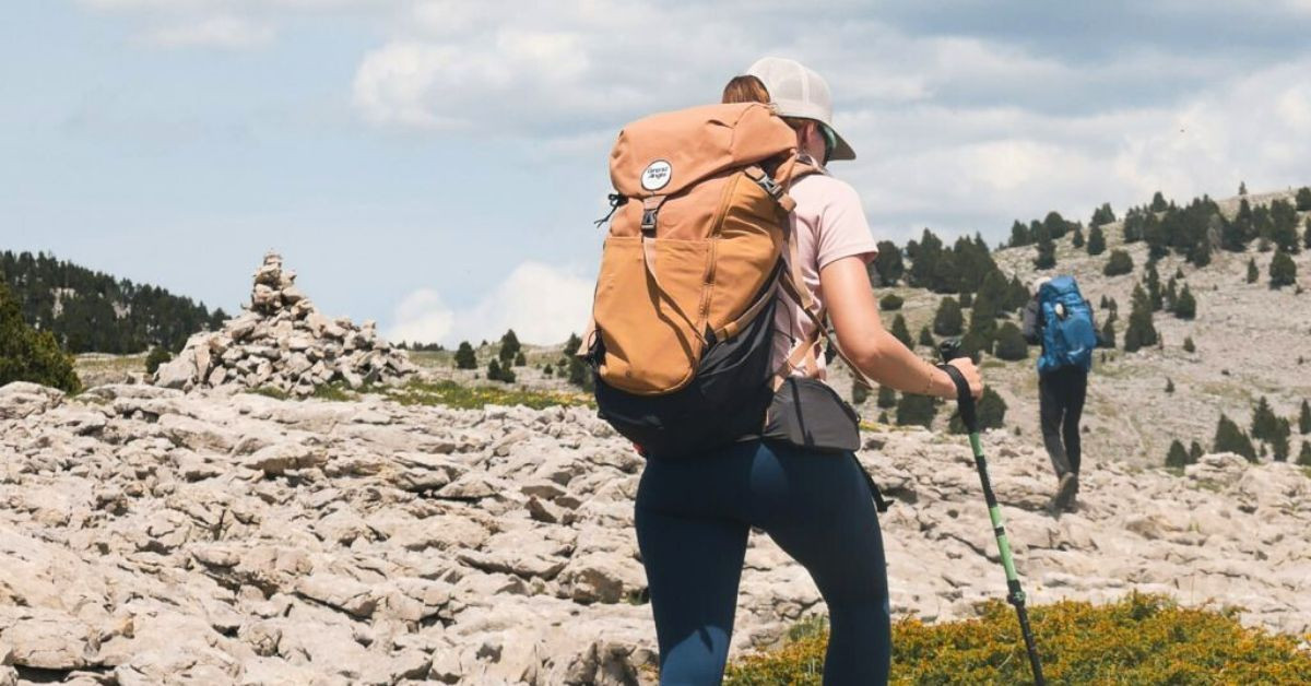 Hiker with backpack on a rocky plateau - Vercors - France