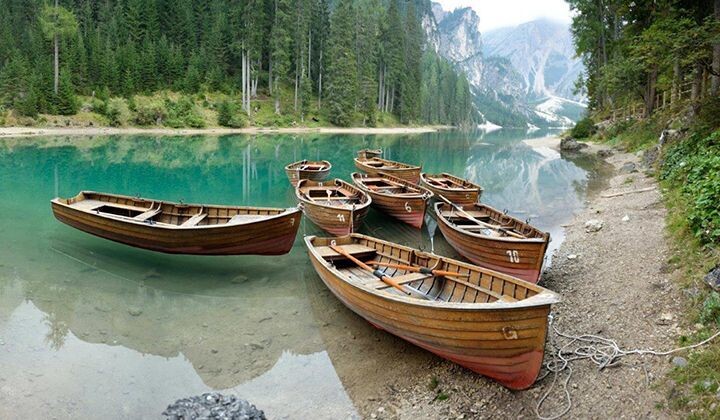 Wooden rowboats on Lake Braies - Dolomites, Italy